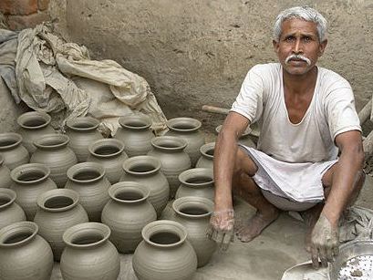 Potter with his wares_ Yann Forget _ Wikimedia Commons _ CC-BY-SA